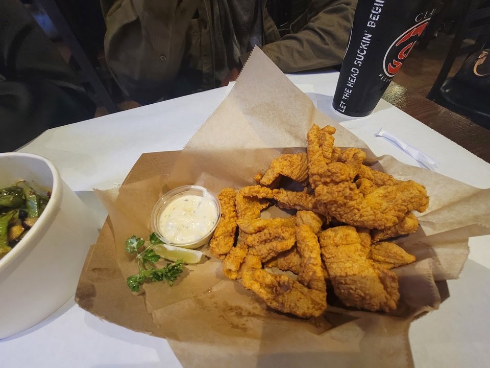 Dine-in tables set for Cajun seafood and shared meals.
